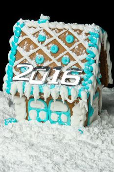Gingerbreadhouse with number 2016 on the roof