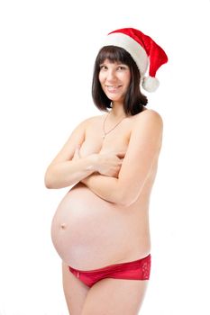 Pregnant young woman in red santa hat isolated on white