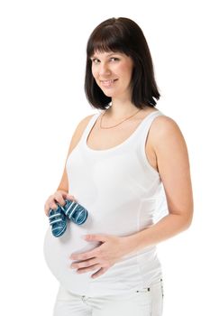 Young woman holding booties isolated on white