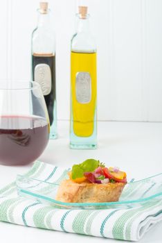 Colorful bruschetta on a glass plate.  Useful for many food service promotional applications.