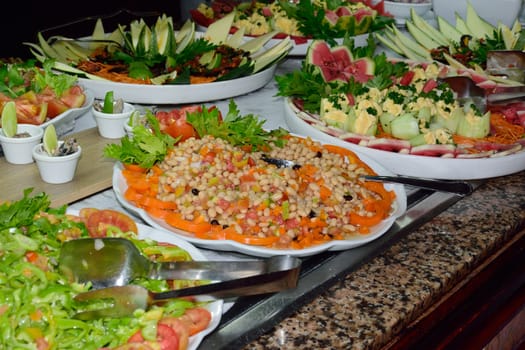 Large Plates of Salad in buffet