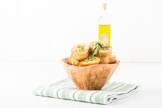Bowl of rosemary and olive oil crostini.  Useful for many food service marketing applications.