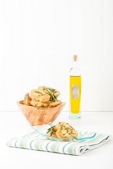 Rosemary and olive oil crostini in a plate.  Suitable for many food service marketing applications.