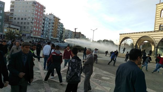 TURKEY, Diyarbakir : Turkish riot police use a water canon to disperse the crowd during clashes between Turkish forces and Kurdish people in the centre of Diyarbakir, as they protest against the curfew in the Sur district of Diyarbakir, on March 2, 2016.
Ankara has repeatedly imposed curfews for military operations in southeastern urban centres, in a measure the government says is necessary to root out PKK militants who were taking de-facto control in some areas. The Cizre curfew was one of the longest but a lockdown has also been in place since December 2 in the central Sur district which is home Turkey's biggest Kurdish majority city, Diyarbakir. According to the HDP, 25 citizens have been killed during the Sur curfew while several centuries-old historic and religious buildings have been destroyed.