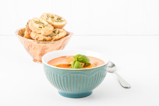 Bowl of creamy tomato basil soup.  Useful for many food service marketing applications.