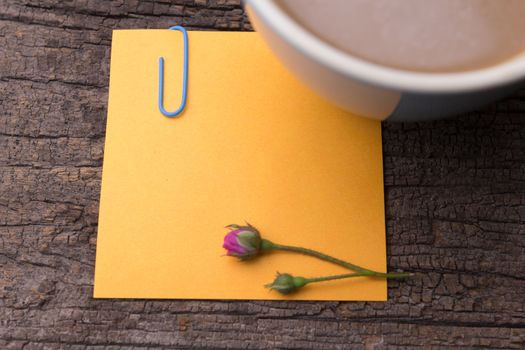 close up of grunge note paper on wooden background