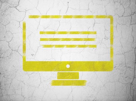 Web development concept: Yellow Monitor on textured concrete wall background