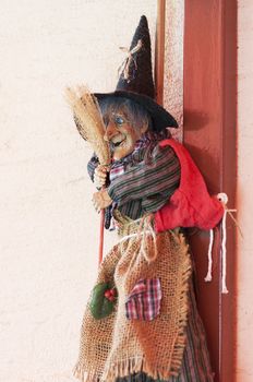 Witch doll with a hat and broom
