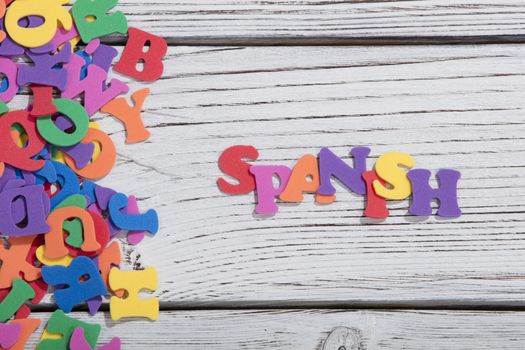 colorful words on white wooden background