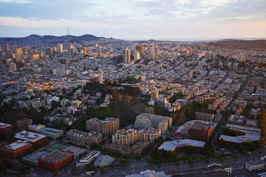 an aerial view of downtown san francisco with pier during sunset