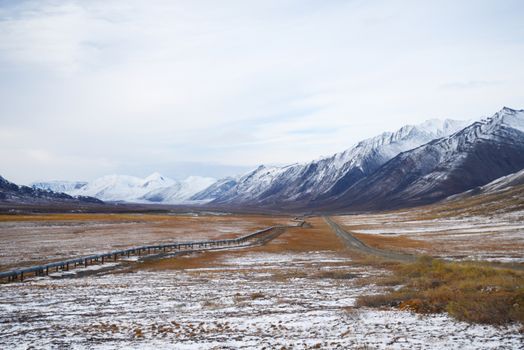 oil pipeline with mountain in northern alaska