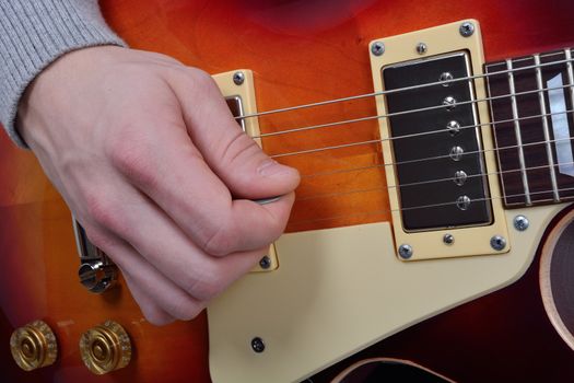 Detailed view of the game on an brown electric guitar