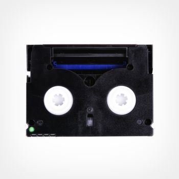 Cassette into the camera isolated on a white background