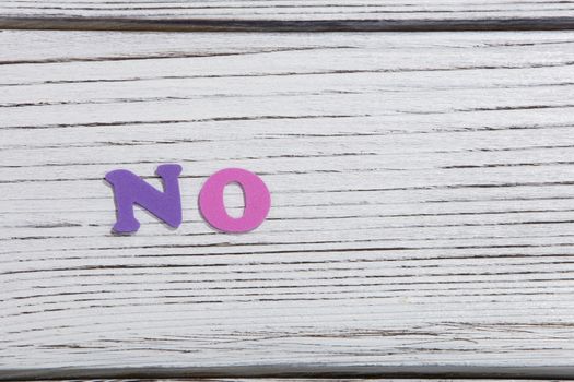 colorful words on white wooden background