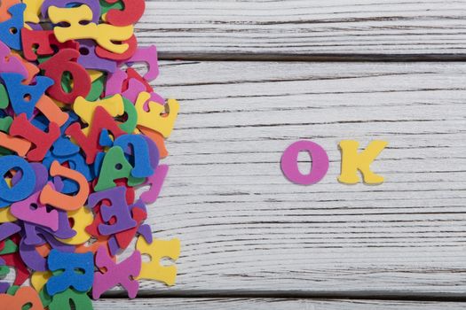 colorful words on white wooden background