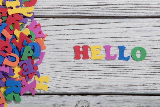 colorful words on white wooden background