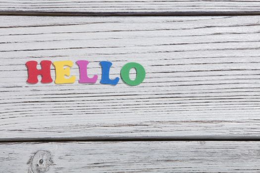 colorful words on white wooden background