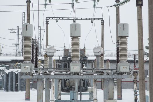 High voltage electric power substation in winter day