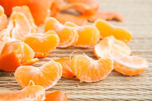 Peeled slices of tangerine on the Mat, separate