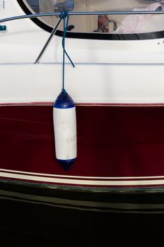 one boat fender to protect the boat when it is in the harbour