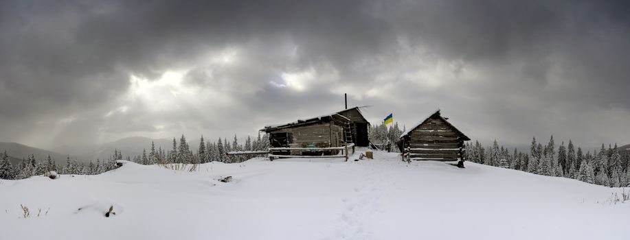 cabins in winter mountain in the evening