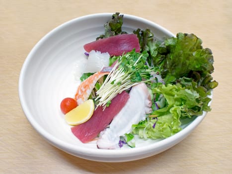 close up of a bowl of japanese fresh seafood salad