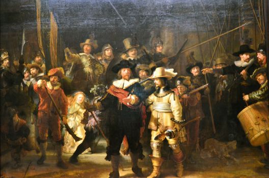 Amsterdam, Netherlands - May 6, 2015: The painting "Night watch" at Rijksmuseum, Amsterdam, Netherlands. The Night Watch is one of the most famous Dutch Golden Age paintings and is window 16 in the Canon of Amsterdam.