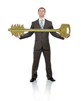 Businessman holdingbig gold key isolated on white background