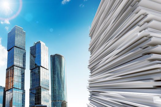 Skyscraper with pile of paper, business concept