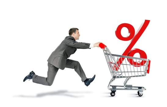 Businessman pushing shopping cart with percentage sign isolated on white background