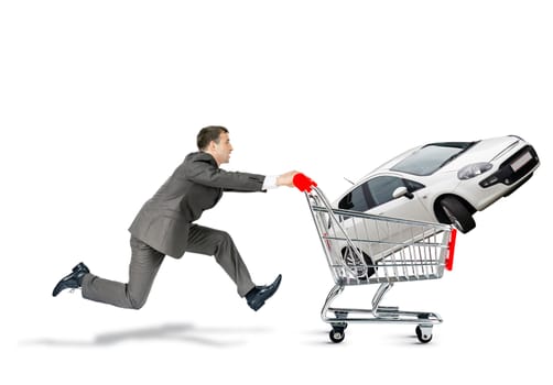 Businessman pushing shopping cart with car isolated on white background
