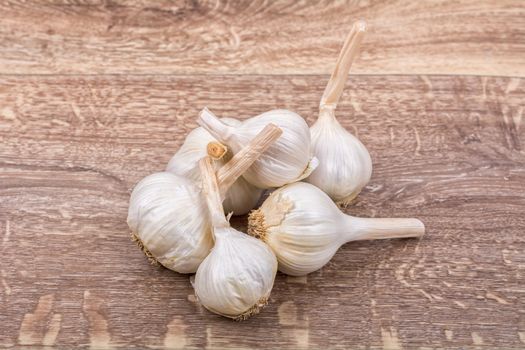 White garlic on a wooden background