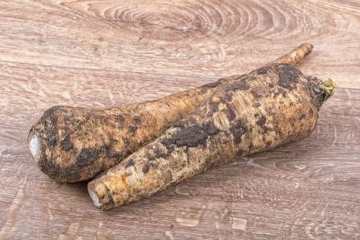 White parsley on a brown wooden background