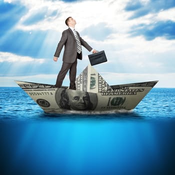Businessman in dollar boat in blue sea, business concept