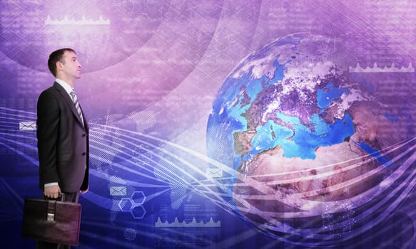Businessman in front of world map with graphical charts, business concept