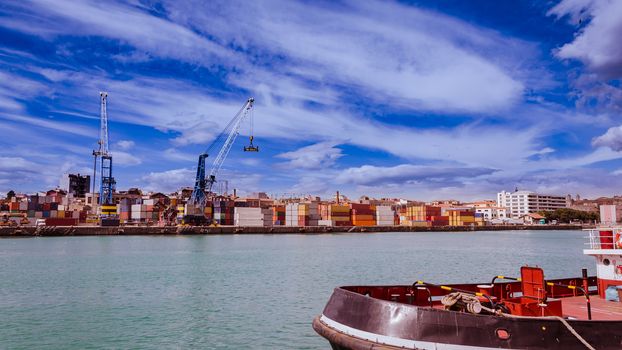 Export or import shipping cargo container stacks and port cranes.