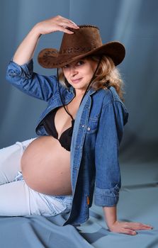 A beautiful Portrait of young pregnant woman in studio