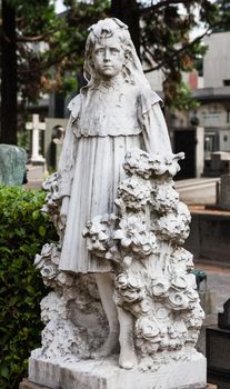 More than 100 years old statue. Cemetery located in North Italy.