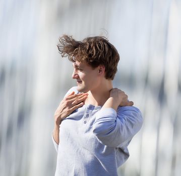 Young Man Standing on the Bridge Looking