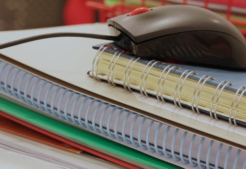 Report, documents and job file placed on table at office.