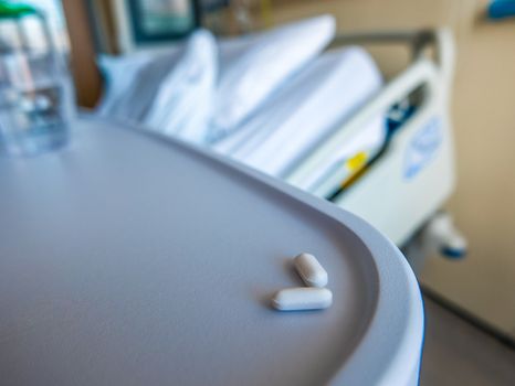 Detail Of A Hospital Room With Bed And Medication In Foreground