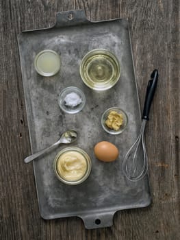 close up of rustic homemade mayonnaise and ingredient