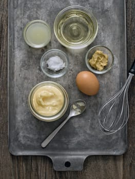 close up of rustic homemade mayonnaise and ingredient