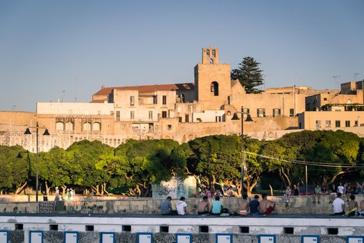 Otranto, Italy - Monday 11, 2014: Tourists visiting the city of Otranto in Apulia vintage