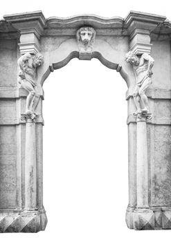 Old white stone entrance with statues that support the side columns.