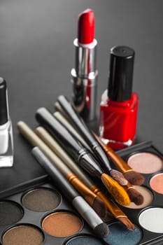 set of decorative cosmetics on a dark background