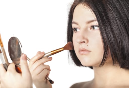 the girl does make-up on a white background