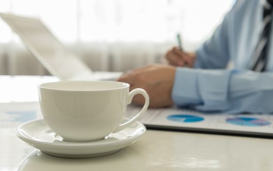 close-up cup coffee on desk's manager