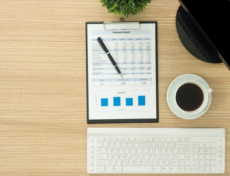 Office table with  computer and report. above view and free space for text.