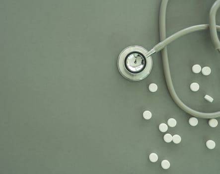 pill and  stethoscope  on table. madical concept